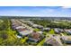 Beautiful aerial view of a residential community with lush landscaping, serene lakes, and well-maintained homes at 19825 Bridgetown Loop, Venice, FL 34293