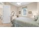 Cozy bedroom featuring a comfortable bed, bright window, and a neutral color palette at 19825 Bridgetown Loop, Venice, FL 34293