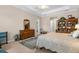 Bedroom featuring a bookcase, large dresser, and a comfortable bed at 19825 Bridgetown Loop, Venice, FL 34293