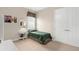 This bedroom features a twin bed, window with valance, and carpet flooring at 19825 Bridgetown Loop, Venice, FL 34293