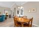 Warm dining area with hardwood floors and natural lighting at 19825 Bridgetown Loop, Venice, FL 34293
