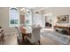 Elegant dining room with bright windows and a modern chandelier at 19825 Bridgetown Loop, Venice, FL 34293
