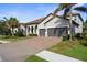 The exterior elevation shows a well-maintained lawn and a three-car garage at 19825 Bridgetown Loop, Venice, FL 34293