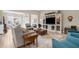 Bright, open living room featuring a large built-in entertainment center and neutral decor at 19825 Bridgetown Loop, Venice, FL 34293