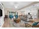 Inviting living room featuring hardwood floors, recessed lighting and open floorplan at 19825 Bridgetown Loop, Venice, FL 34293