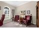 Bright office featuring two leather chairs, a large window, and stylish decor at 19825 Bridgetown Loop, Venice, FL 34293