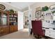 Cozy home office with built-in bookshelves and view to living space at 19825 Bridgetown Loop, Venice, FL 34293