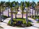 Downtown Wellen Park entrance featuring palm trees, manicured landscaping, and inviting pathways at 19825 Bridgetown Loop, Venice, FL 34293