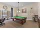 Well-appointed billiards room with a pool table and comfortable seating at 20479 Pezzana Dr, Venice, FL 34292