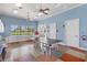 Light-filled clubhouse features a ping pong table, kitchenette, and ample cabinet space, creating a perfect place to gather at 20479 Pezzana Dr, Venice, FL 34292