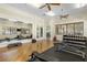 Bright fitness center with floor-to-ceiling mirrors, free weights, and workout machines at 20479 Pezzana Dr, Venice, FL 34292