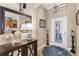 Elegant foyer with a decorative mirror, chandelier, and console table with decorative accents at 20479 Pezzana Dr, Venice, FL 34292