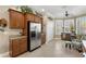 Well-lit kitchen featuring stainless steel appliances, granite countertops, and ample cabinet space at 20479 Pezzana Dr, Venice, FL 34292
