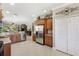 Bright kitchen featuring stainless steel appliances, breakfast nook, and ample counter space at 20479 Pezzana Dr, Venice, FL 34292