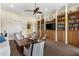 Cozy living room featuring built-in bookcases and comfortable seating at 20479 Pezzana Dr, Venice, FL 34292
