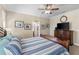 Cozy main bedroom with wood furniture, and an ensuite bathroom at 20479 Pezzana Dr, Venice, FL 34292