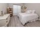 Cozy bedroom features a comfortable bed, a dresser, and bright, light-filled interiors at 208 Corelli Dr, Nokomis, FL 34275