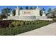 Elegant community entrance sign with fountains and well-manicured landscaping at 208 Corelli Dr, Nokomis, FL 34275