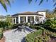 Picturesque fountain surrounded by lush landscaping, creating a serene and inviting outdoor space at 208 Corelli Dr, Nokomis, FL 34275