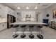 Kitchen island features white cabinets and a modern design, complete with seating at 208 Corelli Dr, Nokomis, FL 34275