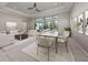 Bright, spacious living and dining area with sliding doors to the pool area at 208 Corelli Dr, Nokomis, FL 34275
