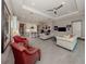 Living room featuring an open floor plan and comfortable seating around the space at 208 Corelli Dr, Nokomis, FL 34275
