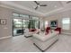 Bright living room boasts an open layout, seamlessly blending indoor and outdoor living at 208 Corelli Dr, Nokomis, FL 34275