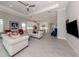 Open-concept living area with kitchen and dining area; great for entertaining friends and Gathering at 208 Corelli Dr, Nokomis, FL 34275