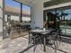 Built-in outdoor kitchen and dining area offers a perfect space for al fresco entertaining by the pool at 208 Corelli Dr, Nokomis, FL 34275