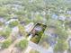 Beautiful aerial view of the property, showcasing its backyard pool, waterfront views, and neighborhood at 214 Whispering Oaks Ct, Sarasota, FL 34232