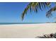 Beautiful beach with white sand and clear blue waters, perfect for relaxation and recreation at 214 Whispering Oaks Ct, Sarasota, FL 34232