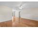 Spacious living room with hardwood floors, neutral paint, decorative trim, and a ceiling fan at 214 Whispering Oaks Ct, Sarasota, FL 34232