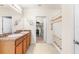 Bright bathroom with double sinks, spacious vanity, and a shower/tub combination behind a shower curtain at 25525 Lambert Ln, Punta Gorda, FL 33950