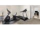 Exercise room with treadmill and bike, next to doorway at 25525 Lambert Ln, Punta Gorda, FL 33950
