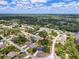 Aerial view of property highlighting its placement within a serene residential community at 2606 Trilby Ave, North Port, FL 34286
