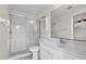 Bathroom featuring a walk-in shower and a spacious vanity at 2606 Trilby Ave, North Port, FL 34286