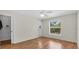 Bright bedroom with hardwood floors and natural light from the window at 2606 Trilby Ave, North Port, FL 34286