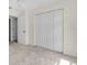 Bright bedroom with carpet, large closet and neutral paint at 2606 Trilby Ave, North Port, FL 34286