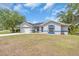 Charming single-story home with a well-maintained front yard and attached two-car garage at 2606 Trilby Ave, North Port, FL 34286