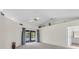 Spacious living room featuring sliding glass doors and ample natural light at 2606 Trilby Ave, North Port, FL 34286
