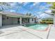 Inviting screened-in pool area with a spacious deck, perfect for outdoor entertaining at 2606 Trilby Ave, North Port, FL 34286
