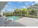 Relaxing screened-in pool area with lush greenery offering a private and serene outdoor space at 2606 Trilby Ave, North Port, FL 34286
