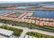 This aerial view shows many homes by the lakes, showcasing the waterfront community at 288 Soliera St, Nokomis, FL 34275