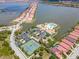 Community aerial view showcasing lakeside homes, clubhouse, pool, and tennis courts in a picturesque setting at 288 Soliera St, Nokomis, FL 34275