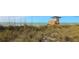 Scenic beach view featuring a lifeguard tower and natural dunes, ideal for relaxation and recreation at 288 Soliera St, Nokomis, FL 34275