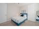 Cozy bedroom featuring a plush bed with decorative pillows and carpeted floors at 288 Soliera St, Nokomis, FL 34275