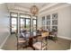 Cozy dining area featuring multiple tables and chairs with view of the exterior amenities at 288 Soliera St, Nokomis, FL 34275