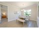 Dining room with a modern table and bench seating and view of the bedroom at 288 Soliera St, Nokomis, FL 34275
