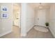 Inviting foyer with decorative wall paneling and view into a stylish bathroom at 288 Soliera St, Nokomis, FL 34275