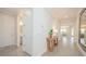 Open hallway with stylish decor, leading to various rooms at 288 Soliera St, Nokomis, FL 34275